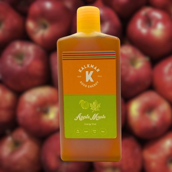Apple Ahorn energy shots fles met appels in de achtergond